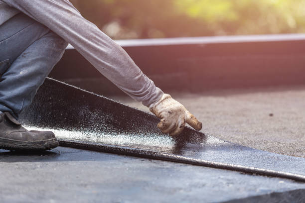 Professional Emergency Waterproofing technician working in Perrinton, MI